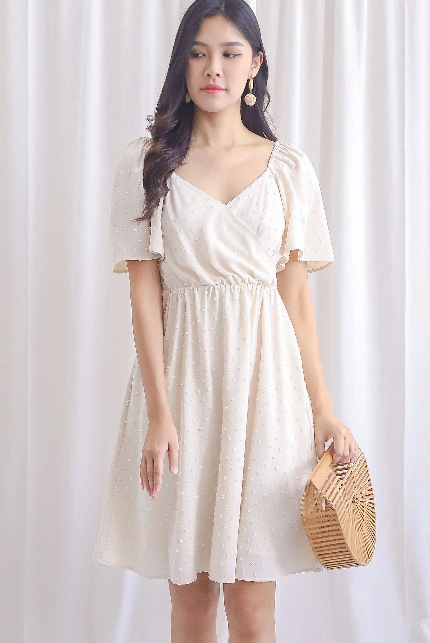 Elly Swiss Dot Flutter Sleeve Dress In Cream
