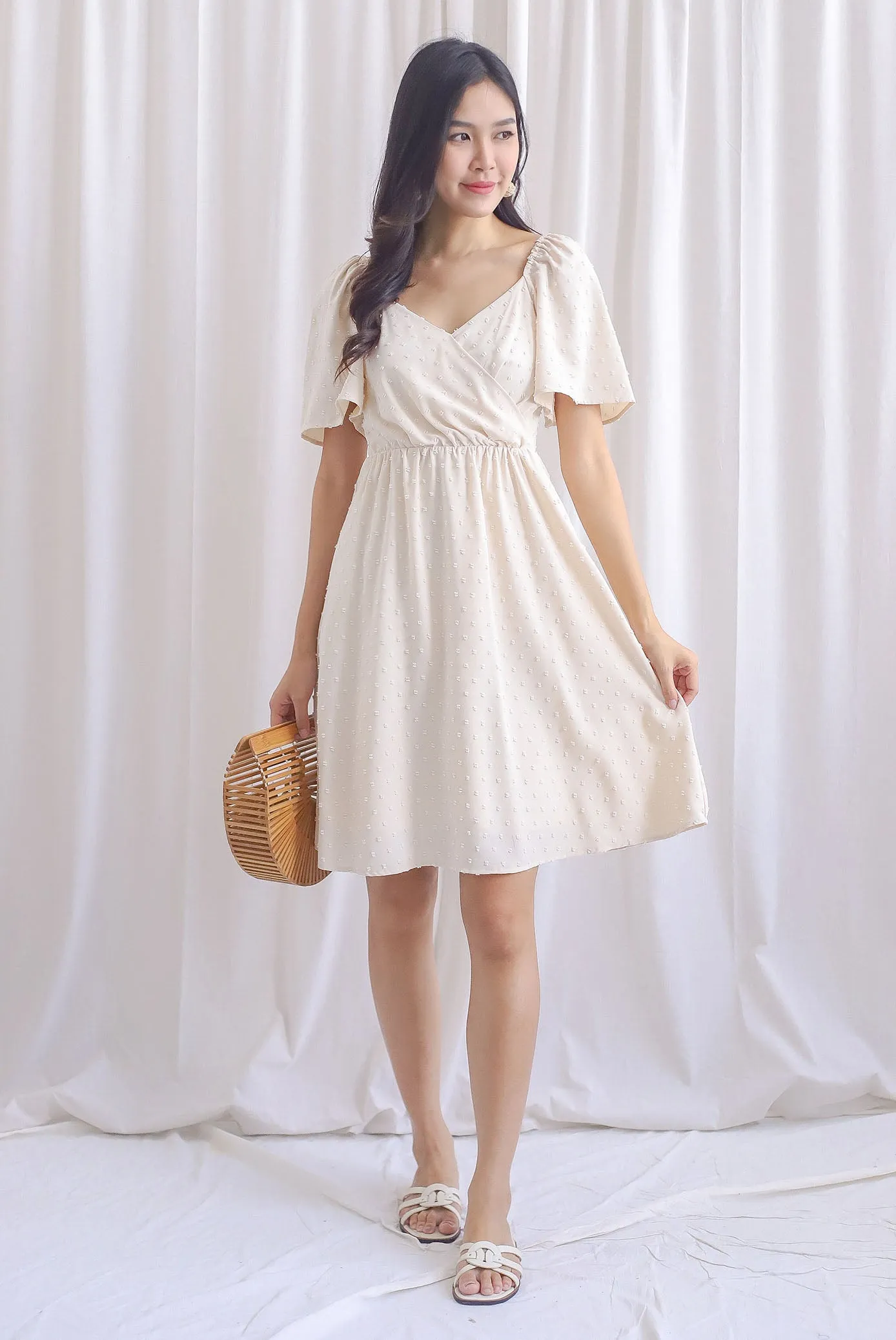 Elly Swiss Dot Flutter Sleeve Dress In Cream