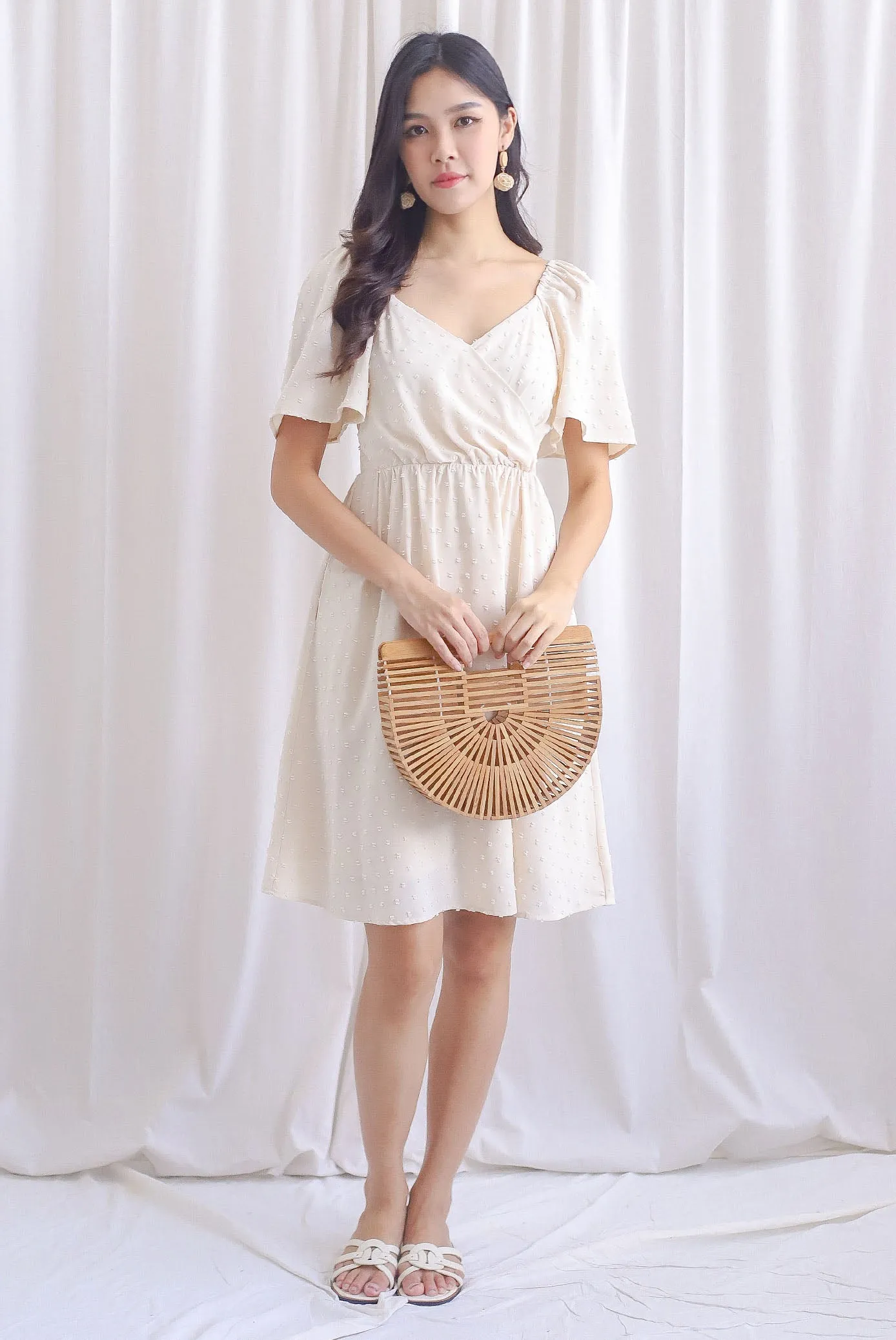 Elly Swiss Dot Flutter Sleeve Dress In Cream