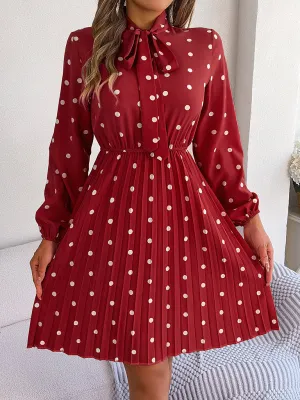 Polka-Dot Long-Sleeved Mini Dress with Pleated Skirt and Bow Tie Neckline